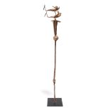 A Yoruba medicine staff Nigeria iron with two birds and cones, 84cm high, on a base. (2)