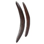 Two Aboriginal boomerangs Australia with incised decoration, 68.5cm and 56.6cm wide. (2)