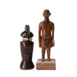 A Kwere doll Tanzania with glass beads, 13.5cm high, and a Zulu carved male figure, holding a shield