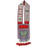 An Ojibwa bandolier bag Northeast North America red trade cloth, cloth, coloured glass beads, with