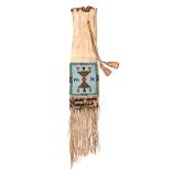 A Blackfoot pipe bag Plains buckskin and coloured glass beads, the wavy top with bead edging and