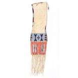 A Sioux pipe bag Plains buckskin, rawhide, coloured glass beads and quill, the top with a beaded