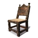 An Ashanti chair asipim Ghana wood with embossed sheet brass, brass tacks and hide, the back with
