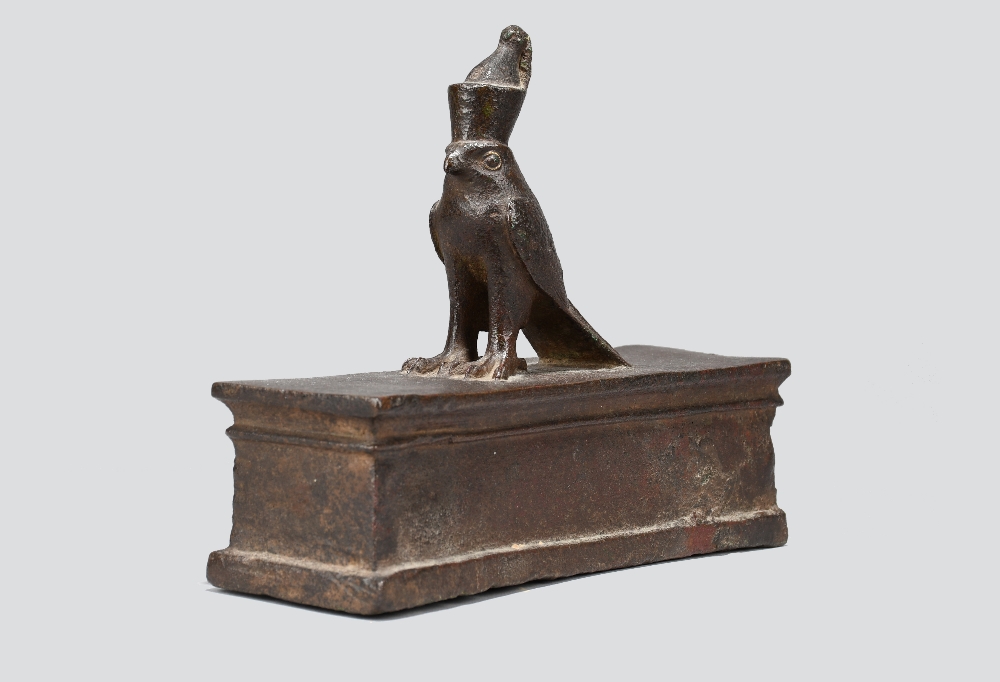 An Egyptian bronze Horus falcon sarcophagus Late Period, circa 664 - 332 BC the falcon deity wearing