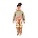 An Inuit doll Greenland wood, sealskin, cloth, hair and beads, in traditional dress, circa 1900,
