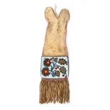 A Cree or Saulteaux pipe bag Subarctic buckskin and coloured glass beads with differing floral