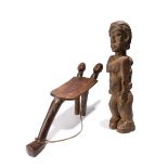 A Lobi anthropomorphic stool Burkina Faso with a fibre strap, 30cm high, and a Lobi maternity