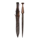 A Fang knife Gabon steel, brass wire, brass tacks and wood, the blade part engraved, 49.5cm long,