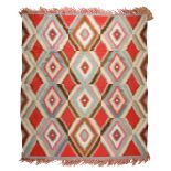 A Navajo Germantown rug Southwest North America with an eye-dazzler serrated diamond lattice design,