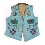 A Plateau vest possibly Flathead canvas, cloth and coloured glass beads with floral designs to the