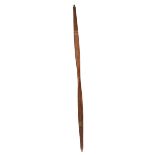 An Inuit bow Pacific, Alaska cedar, with a channeled ridge to the flat side and with intricately