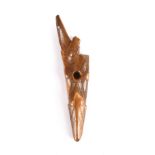 λAn Inuit harpoon head Old Bering Sea, circa 400 - 800 AD walrus ivory, with stylised animal head