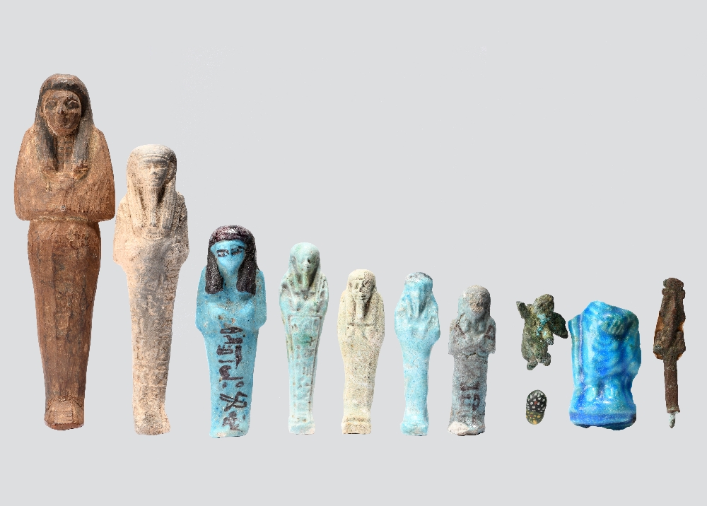 Seven Egyptian shabtis New Kingdom - Late Period, circa 1500 - 332 BC and later including a wood