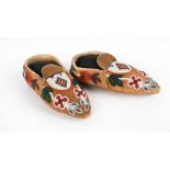 A pair of Ojibwa moccasins Canada smoked moosehide and coloured glass beads of floral and