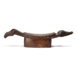 An Iatmul zoomorphic headrest Middle Sepik River, Papua New Guinea with a block support to the