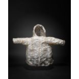 An Inuit child's parka Alaska seal gut, sealskin, seal? fur and red and natural fibre, the back with