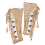 A pair of Western Sioux men's leggings Plains buckskin and coloured glass beads, of tapering form