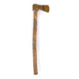 A North American tomahawk with a brass head and a wood shaft with two lead bands and a cap, with