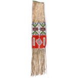 An Arapaho pipe bag Plains buckskin, coloured glass beads and dyed quill, the main panels with