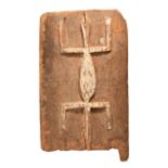 A Dogon granary door Mali with a relief carved lizard, with white pigment, 51.2cm x 30cm.