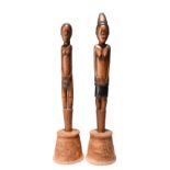 A pair of Tsonga / Zulu staff finials Mozambique / South Africa carved as a woman and a man, both