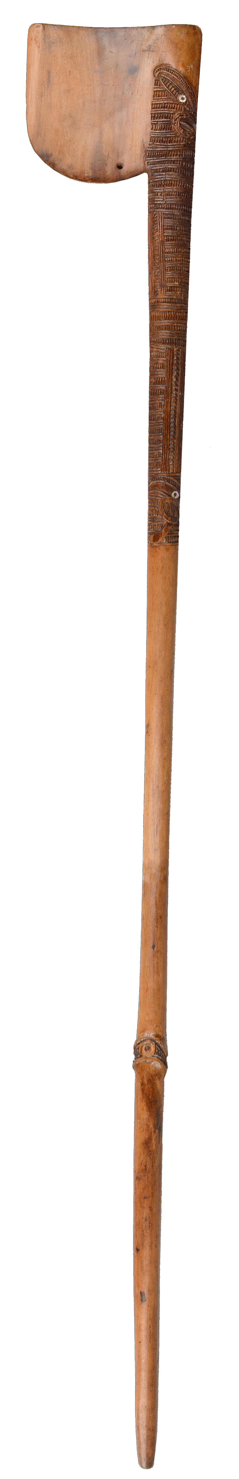A Maori tewhatewha club New Zealand with a rounded blade, pierced for attachment, with carved linear