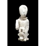 A Ewe power figure Ghana the seated figure with an outstretched right arm and wearing a bead