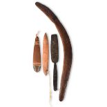 An Aboriginal boomerang Australia with a fine carved textured finish to both sides, 61.5cm long, two