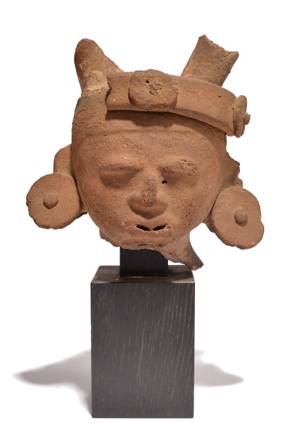A Veracruz head Mexico, circa 500 - 700 AD earthenware, with the remains of a headband and with