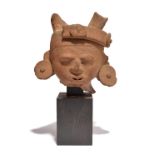 A Veracruz head Mexico, circa 500 - 700 AD earthenware, with the remains of a headband and with