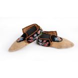 A pair of Ojibwa moccasins North East North America buckskin, cloth, velveteen, silk and coloured