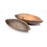 Two Papua New Guinea feast bowls Melanesia one stained and with dots to the inner rim, 43.3cm and