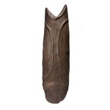 A Highlands shield Papua New Guinea with ribbed outlines and a forked top, with a fibre handle,
