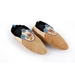 A pair of Athapaskan moccasins Subarctic smoked moose hide, caribou, velvet, coloured thread, dyed