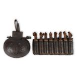 A set of eight Turkish gunpowder cartridges, wooden, with turned tops and elegantly tapering spouts,