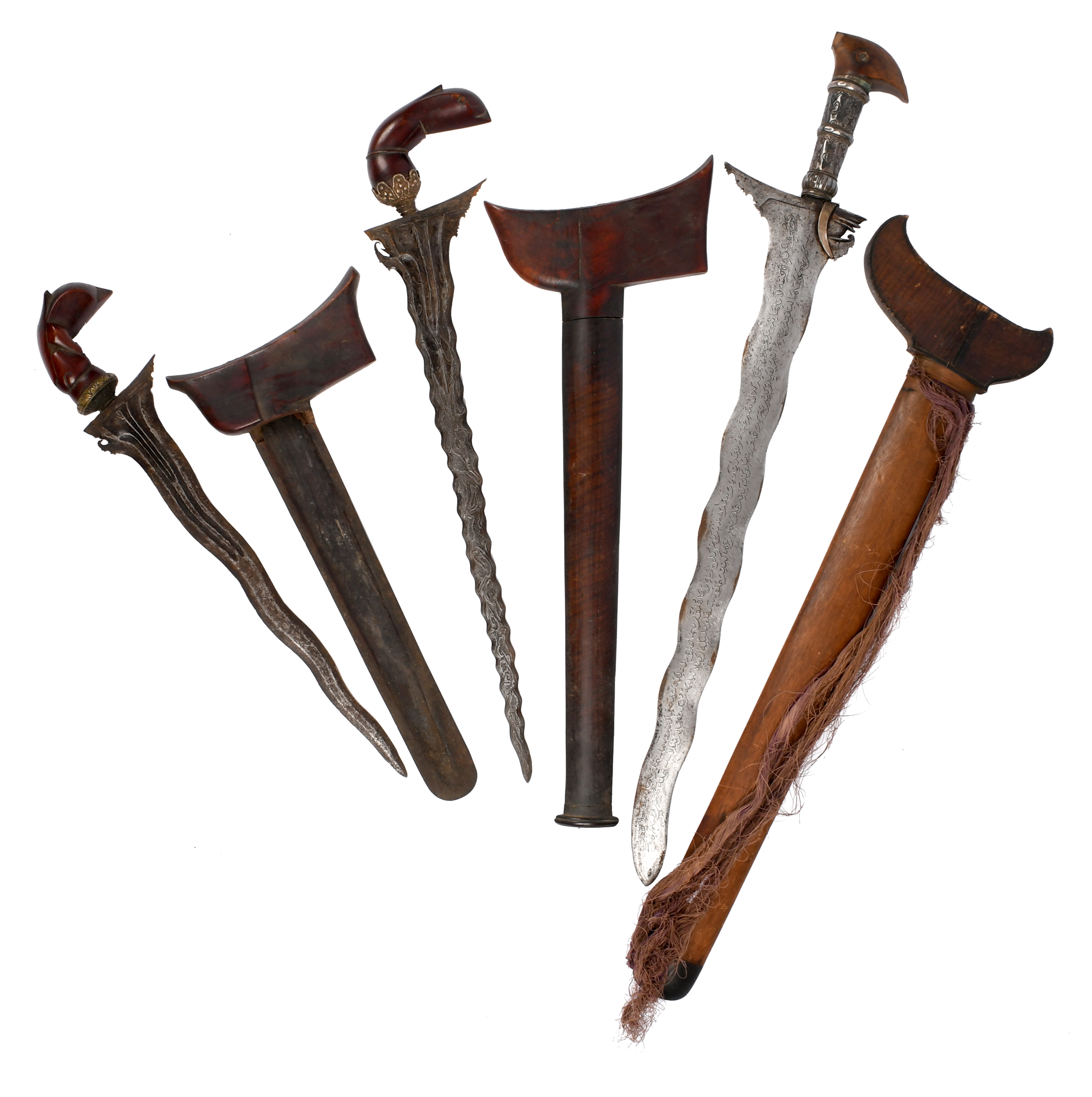 Malay Archipelago: three daggers (kris): a Moro example, broad wavy blade 20 in., each side