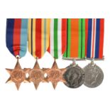 A recently issued group of WWII campaign medals, comprising: 1939-45 Star, Africa Star, Italy