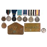 A quantity of medals and associated items, including: a Silver War Badge, number B32080; a Garrard &