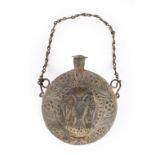 An unusual lead powder flask, round body with moulded decoration, the central device being a