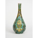 A Della Robbia Pottery vase by Hannah Jones and Charles Collis, slender bottle form, incised with