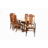 A Heal's polished oak Letchworth table, and four en suite chairs and two carvers, the carvers with