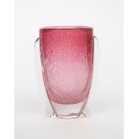 A glass vase in the manner of Daum, flaring cylindrical form, pale pink glass cased in clear with