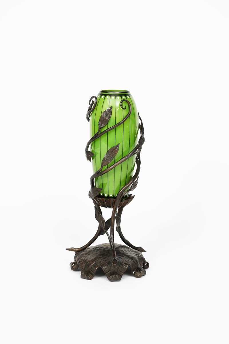 An Austrian Secessionist glass vase with wrought iron mount, slender, swollen green cylindrical