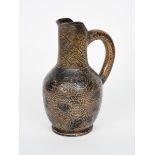 A Martin Brothers stoneware jug by Robert Wallace Martin, ovoid body with pulled vertical neck and