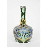 A tall Art Nouveau Dutch pottery vase, shouldered form with tall cylindrical neck, painted with blue