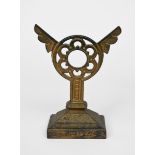 A wrought-iron doorstop designed by Dr Christopher Dresser, tapering rectangular section, the