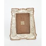 A Winifred Green for C S Green & Co silver picture frame, stamped in low relief with a young girl