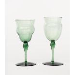 Two James Powell & Sons Whitefriars emerald green wine glasses designed by T G Jackson, each with