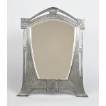 A large WMF Secessionist pewter dressing table mirror, model no.120, shaped and pierced