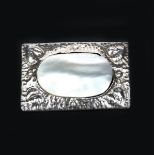 A George Hunt silver and abalone brooch, rectangular hammered frame with simple leaf motif set